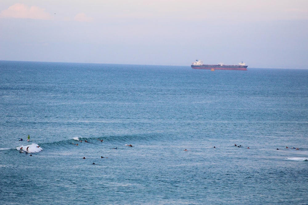 white ship on sea during daytime