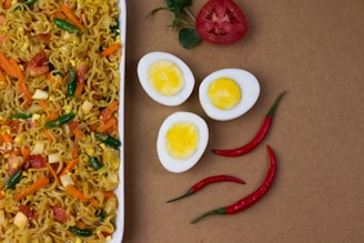 red chili and egg on white ceramic plate