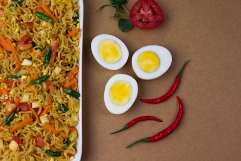 red chili and egg on white ceramic plate