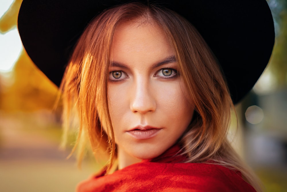 woman in red shirt with blonde hair