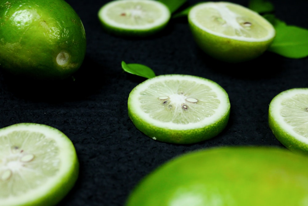 sliced lime on black textile