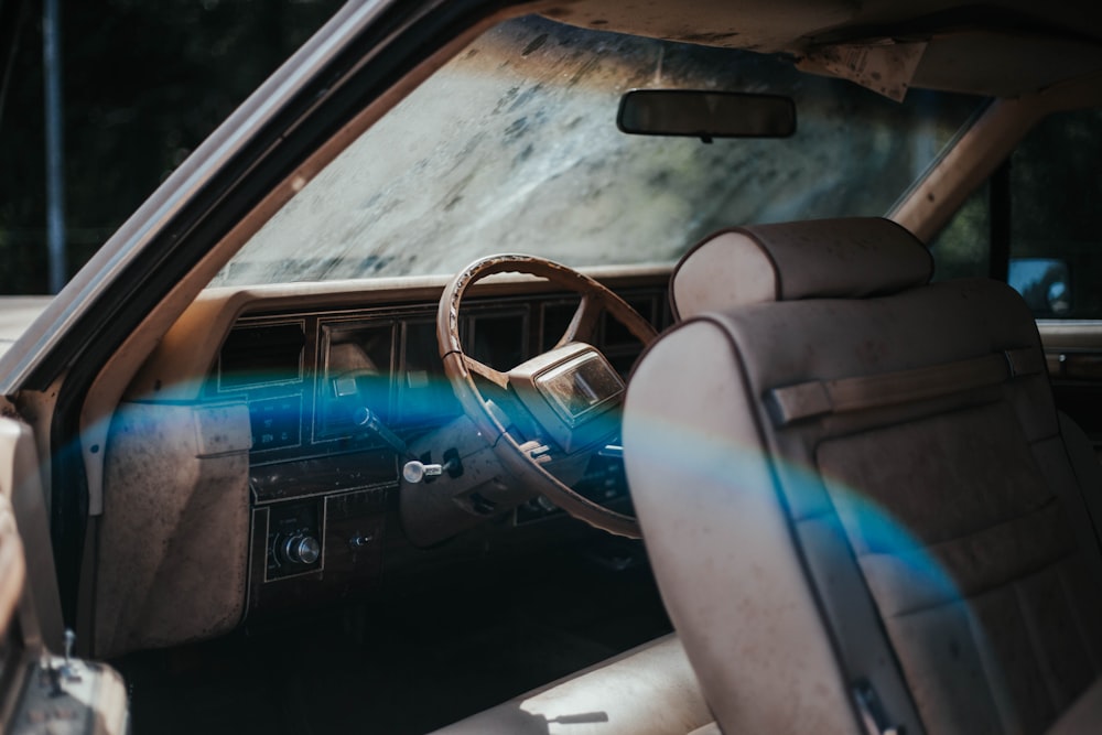 black car door with brown steering wheel