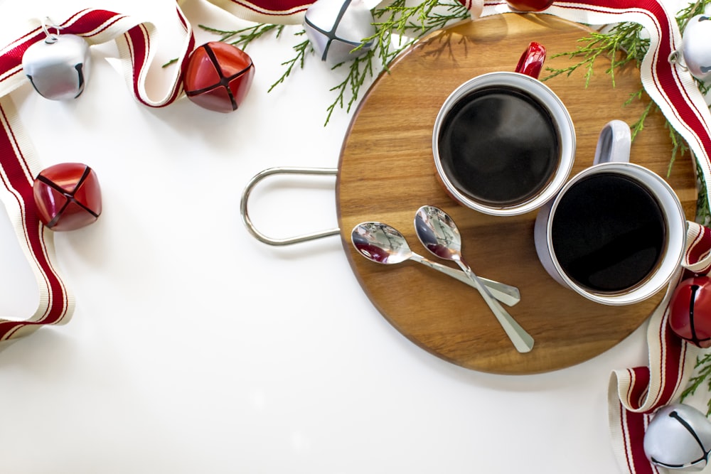 black and white ceramic mug on brown wooden table