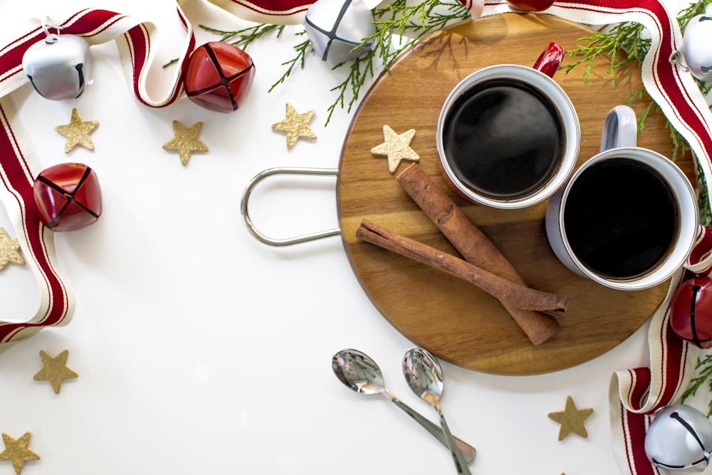 white ceramic mug on brown wooden chopping board