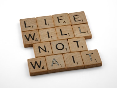 wooden scrabble blocks on white surface