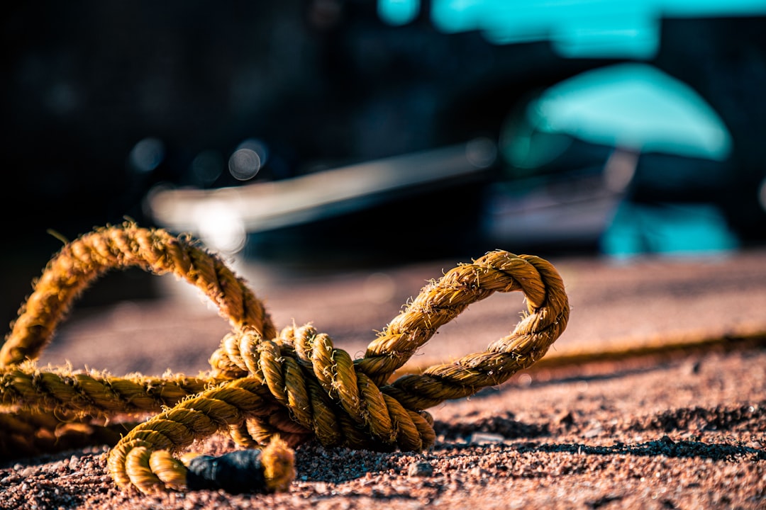  brown rope on brown wooden table string