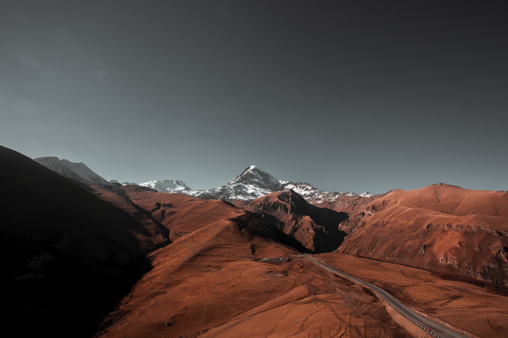 brown rocky mountain under blue sky during daytime