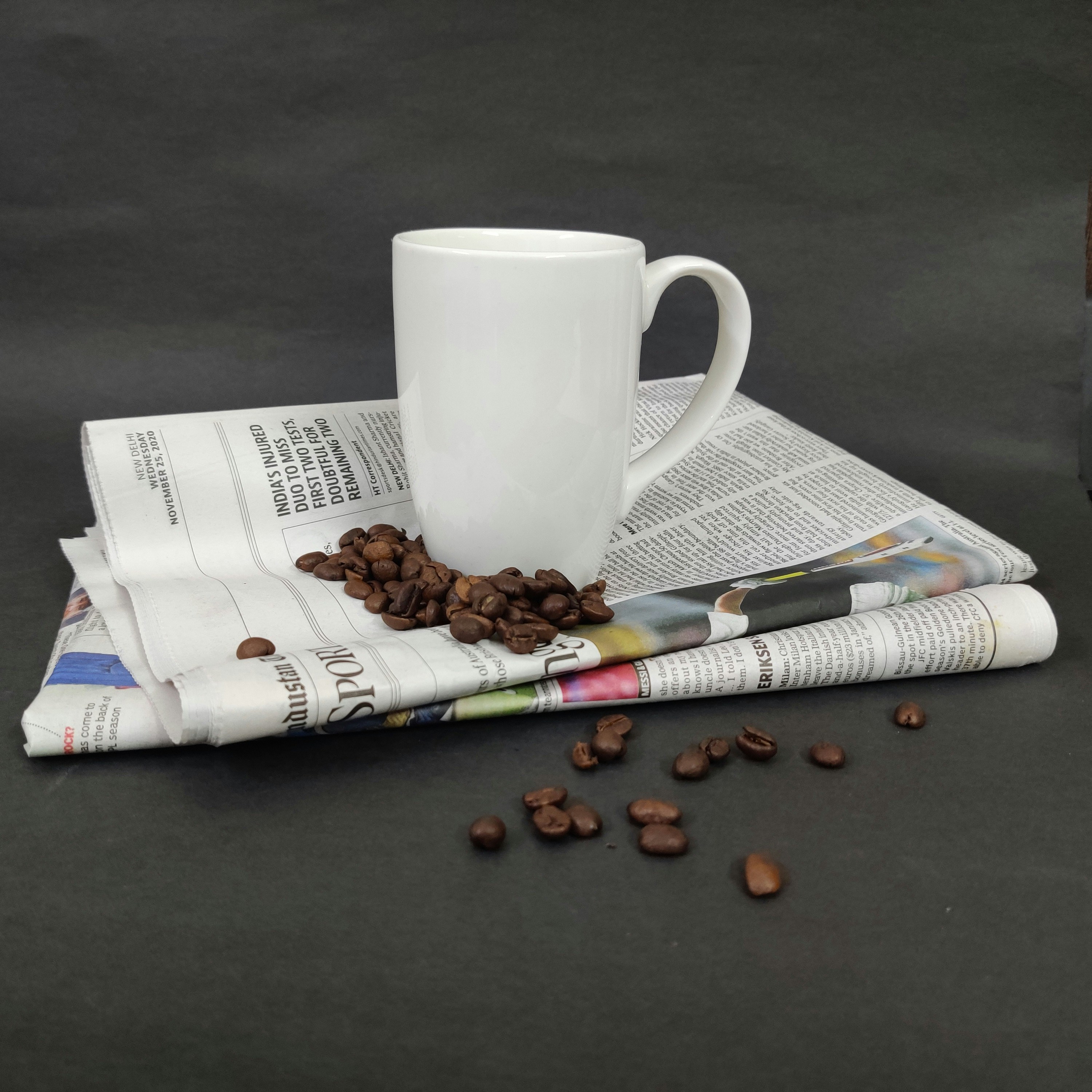 facticity: white ceramic mug on white paper