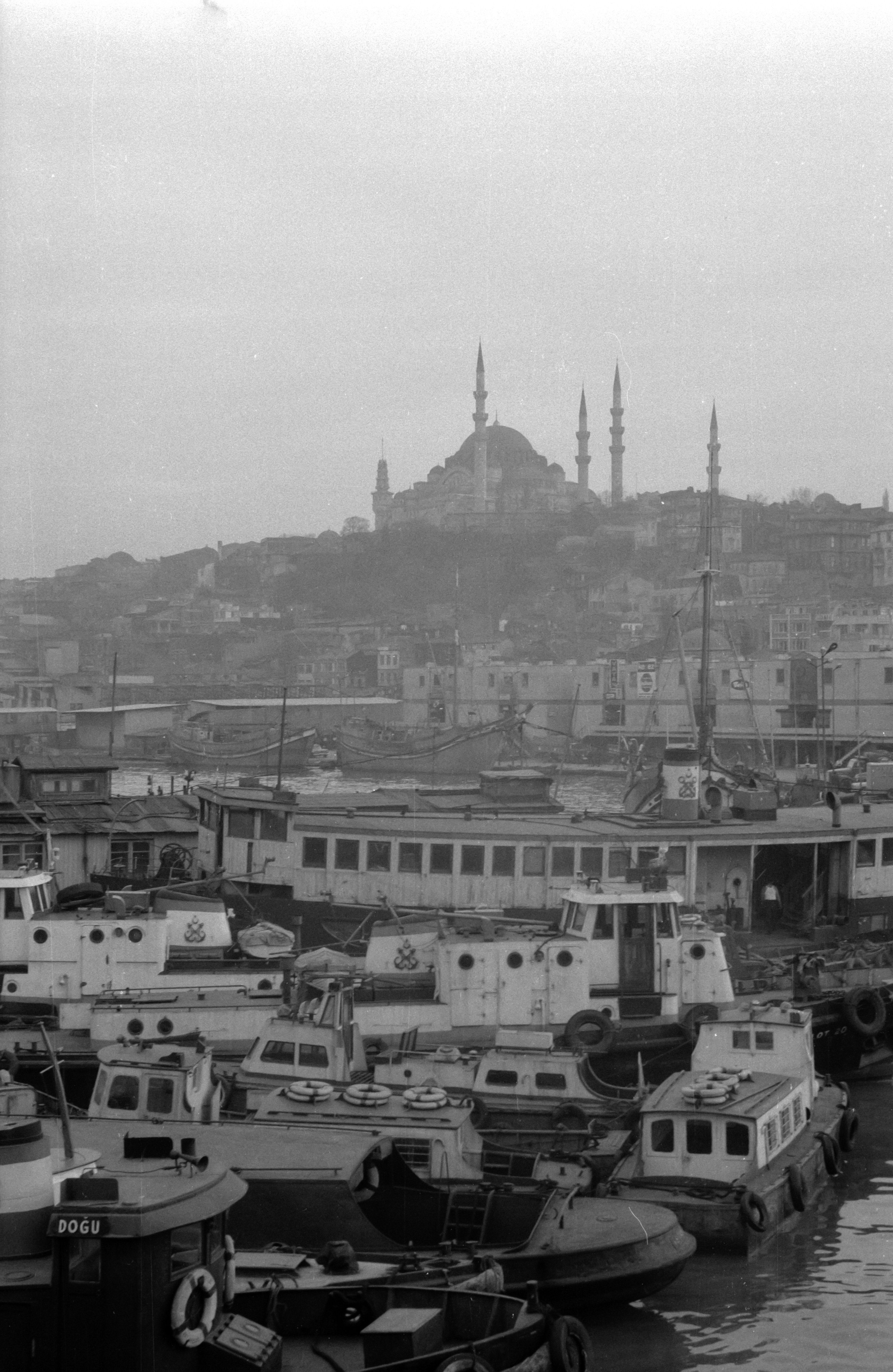 grayscale photo of city buildings