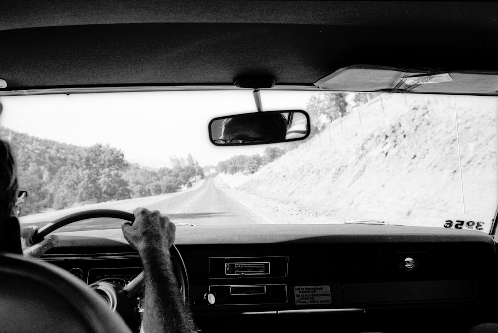 grayscale photo of car on road