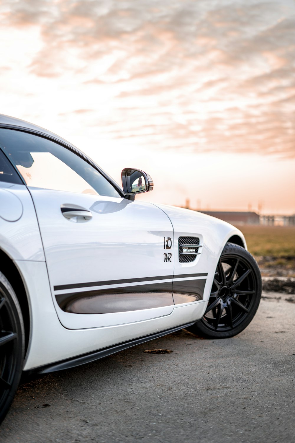 white mercedes benz coupe on road during sunset