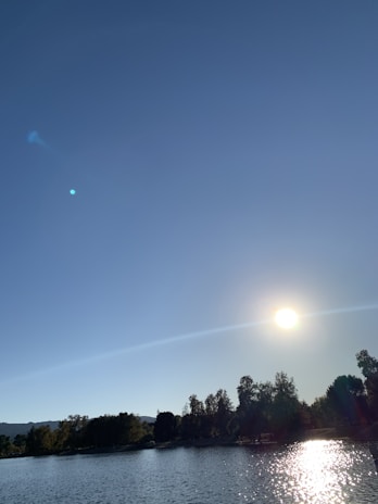 A serene landscape under a bright blue sky, symbolizing a clean and clear planet.