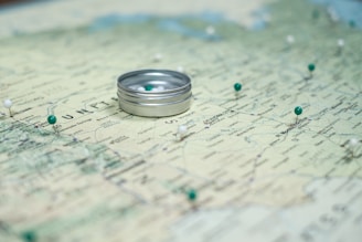 silver ring on white and blue textile
