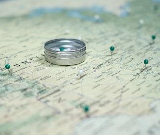 silver ring on white and blue textile