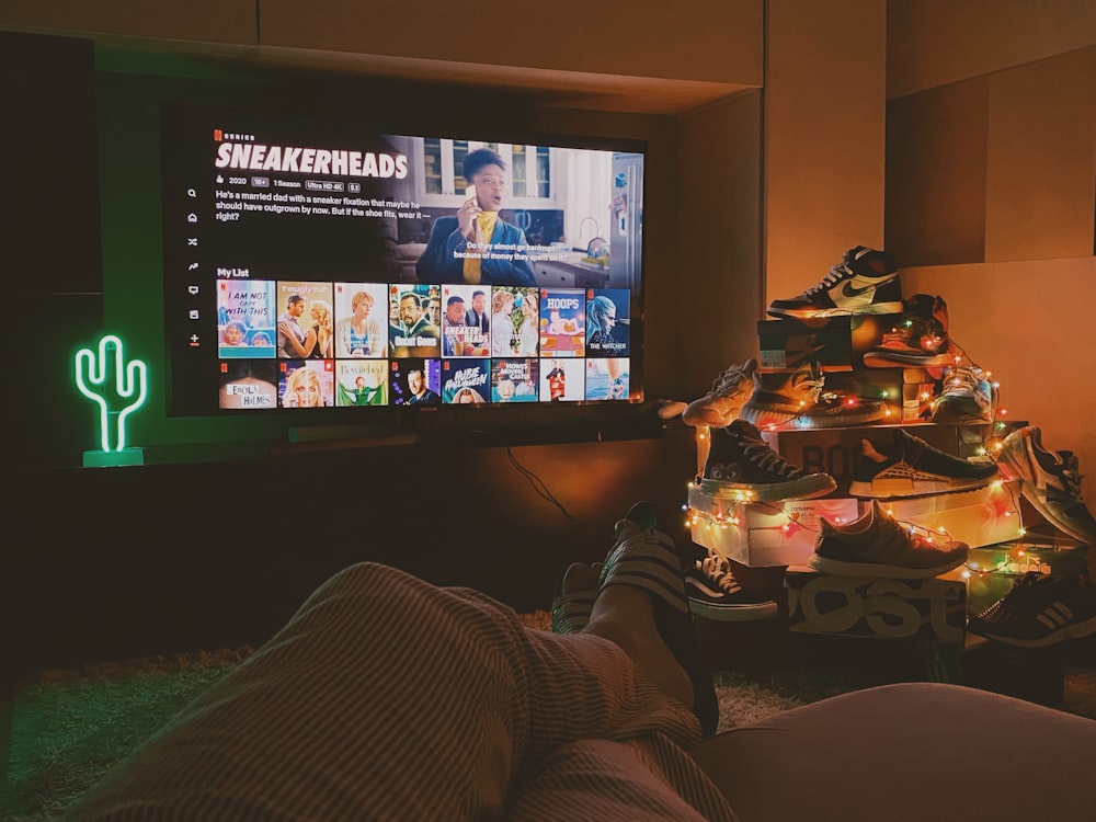 black flat screen tv turned on displaying man in black suit