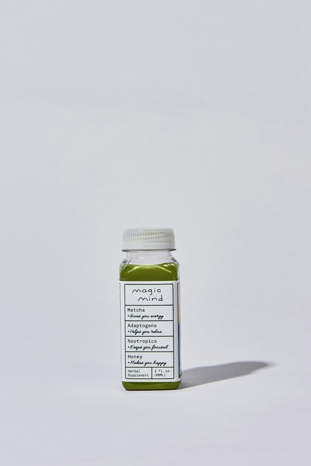 white and green labeled bottle