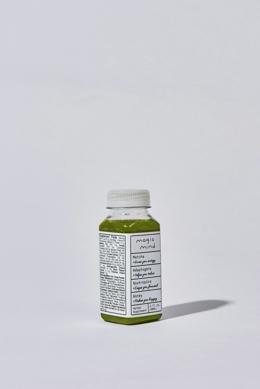 white and green labeled bottle