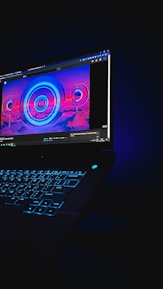 Close-up of a glowing neon orange AI interface overlaying a laptop screen in a modern workspace.