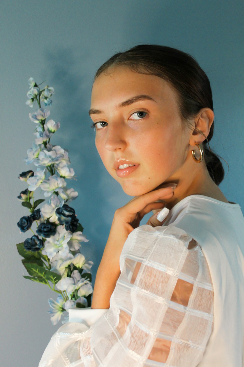 woman in white shirt with white earbuds