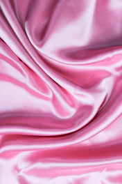pink textile in close up photography