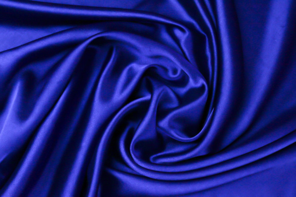 blue textile in close up photography