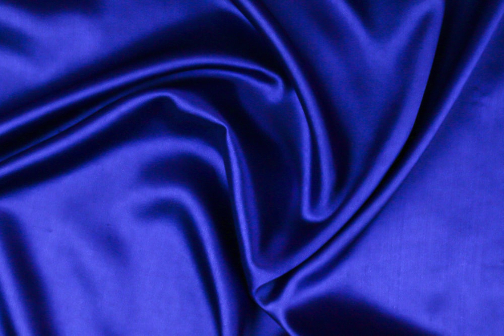 blue textile on brown textile