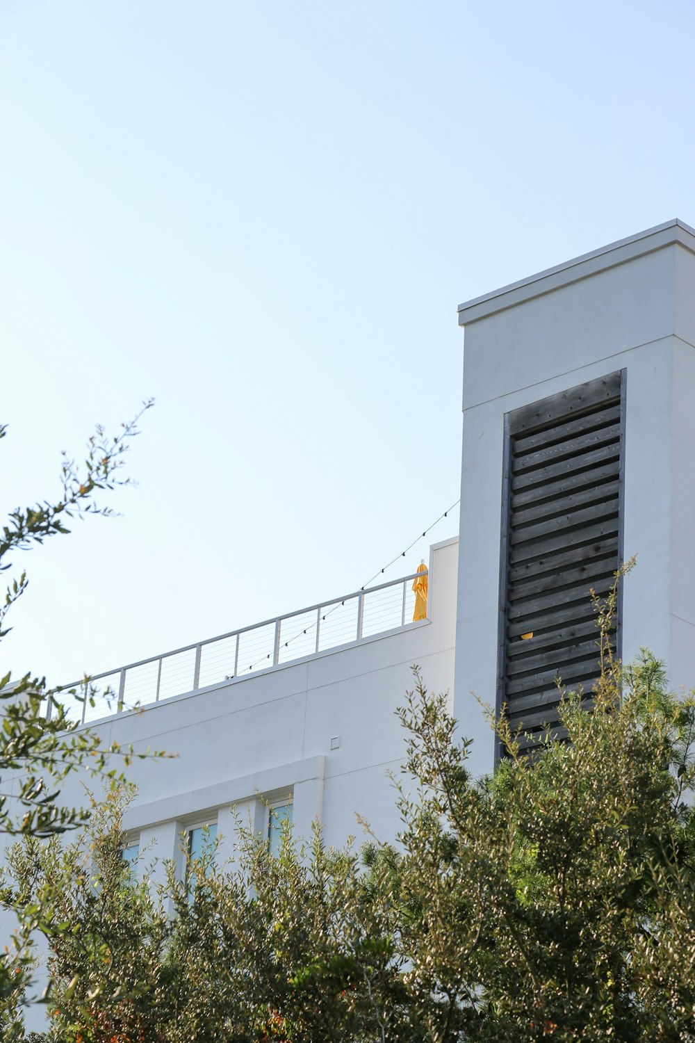 white concrete building with black steel gate