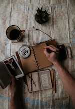 person holding black and white box
