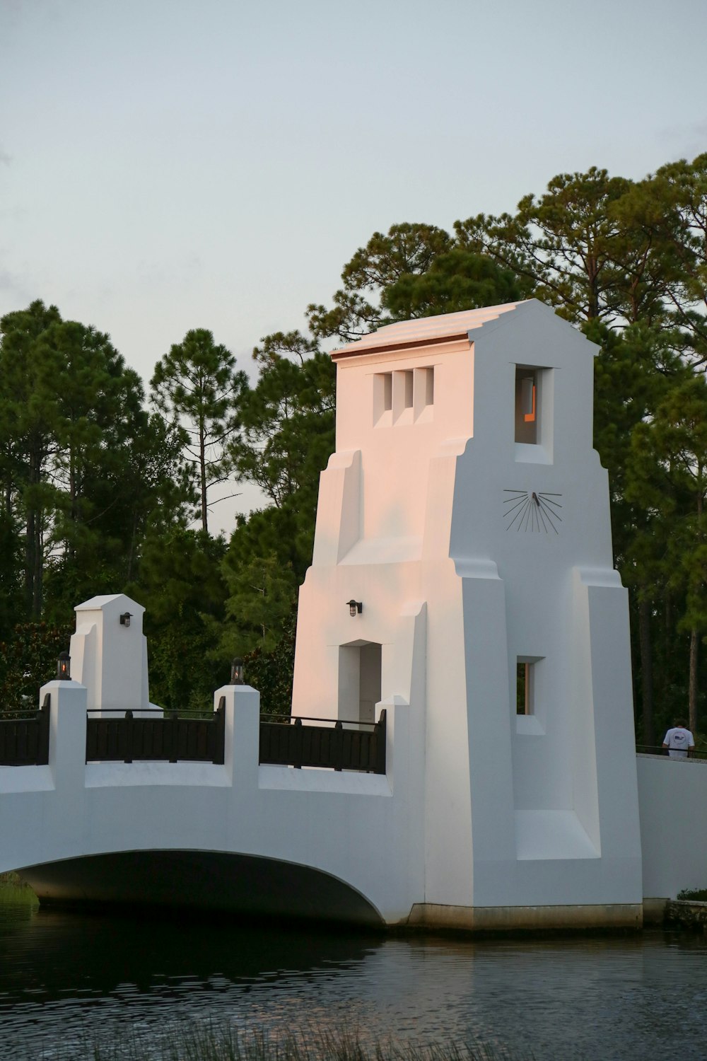 white concrete building near green trees during daytime