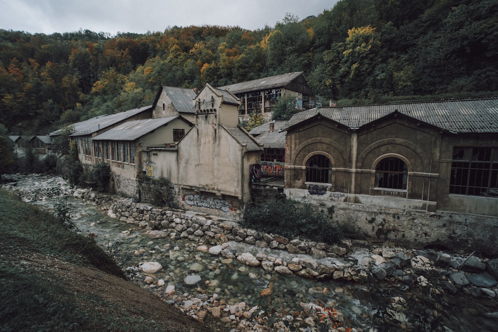 gray concrete building near river during daytime