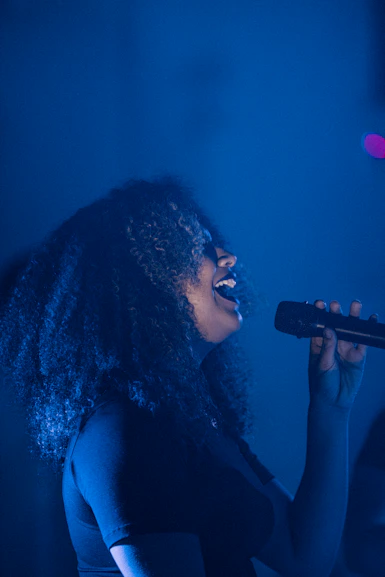 woman singing on the stage