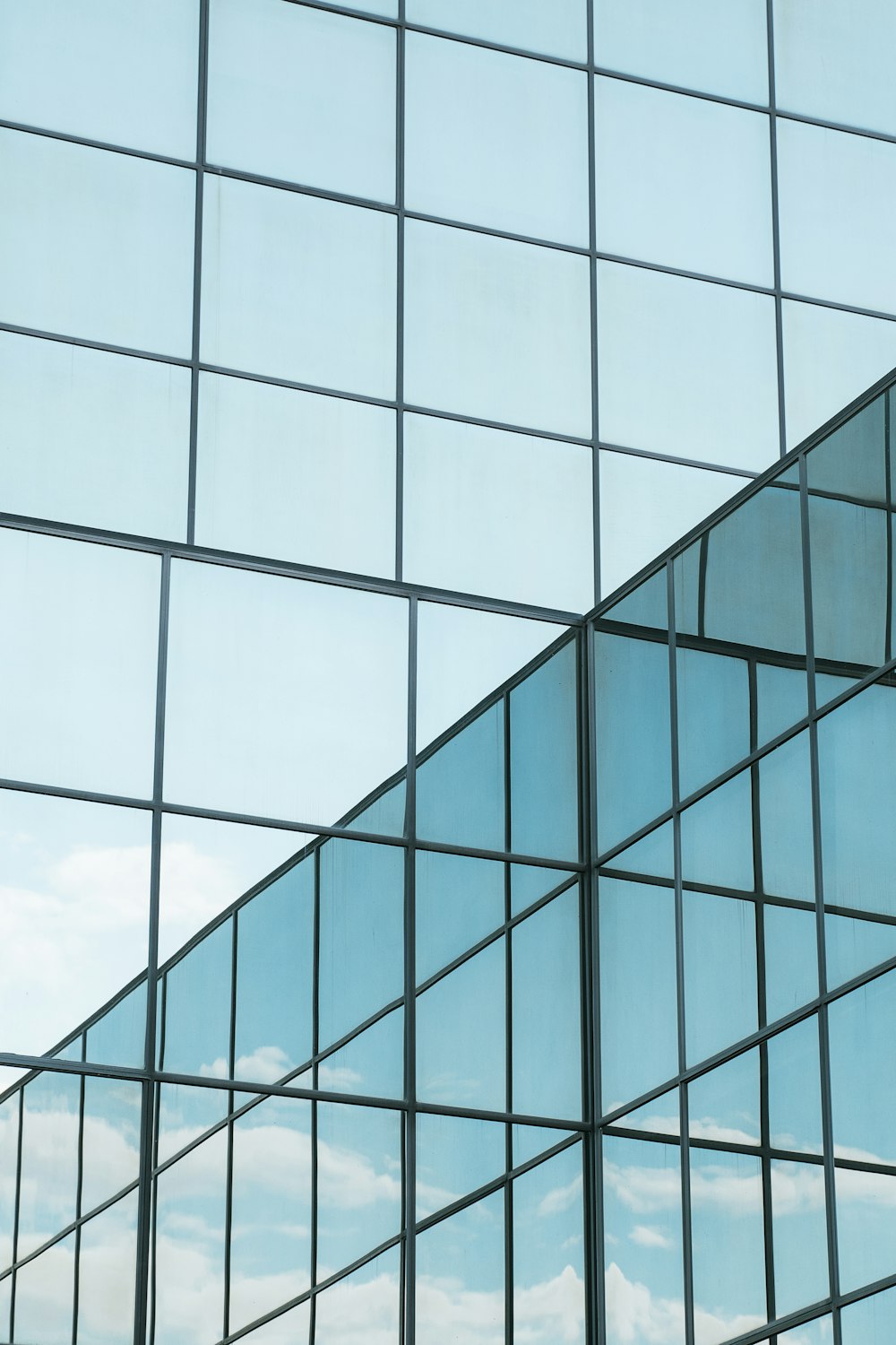 blue glass walled high rise building