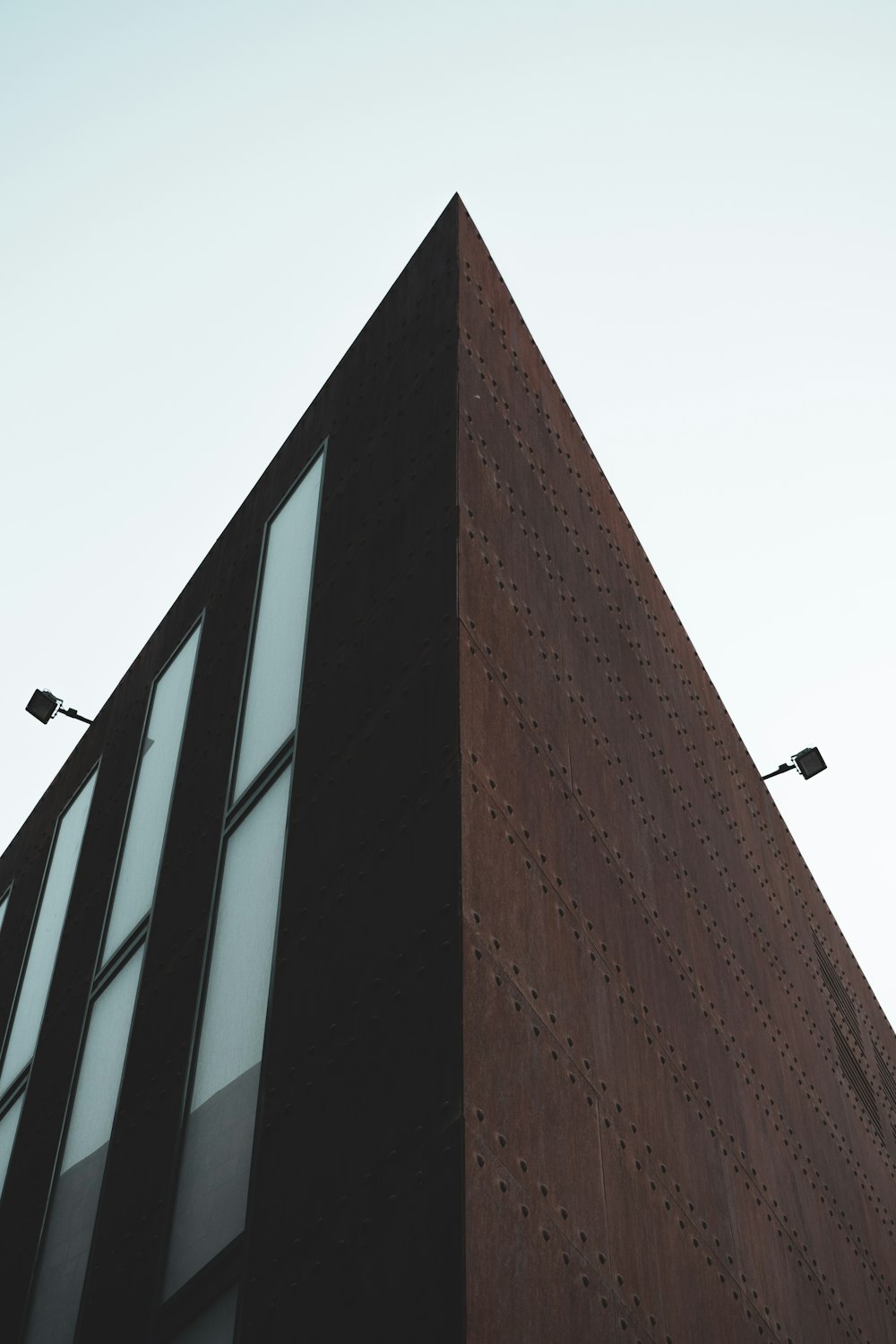 brown concrete building under white sky during daytime