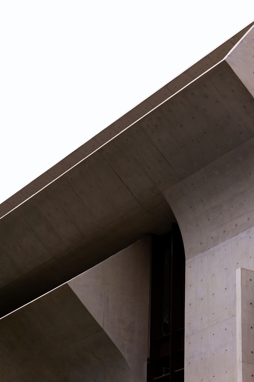 white concrete building under white sky during daytime