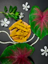green leaves beside yellow and green leaf