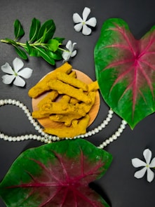 green leaves beside yellow and green leaf