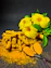 yellow flower on gray surface