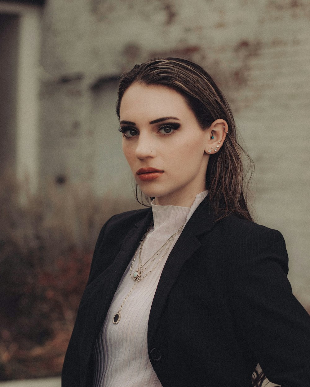 woman in black blazer standing