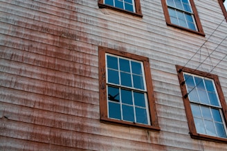 Close-up image of new siding being installed on a classic New York brownstone.