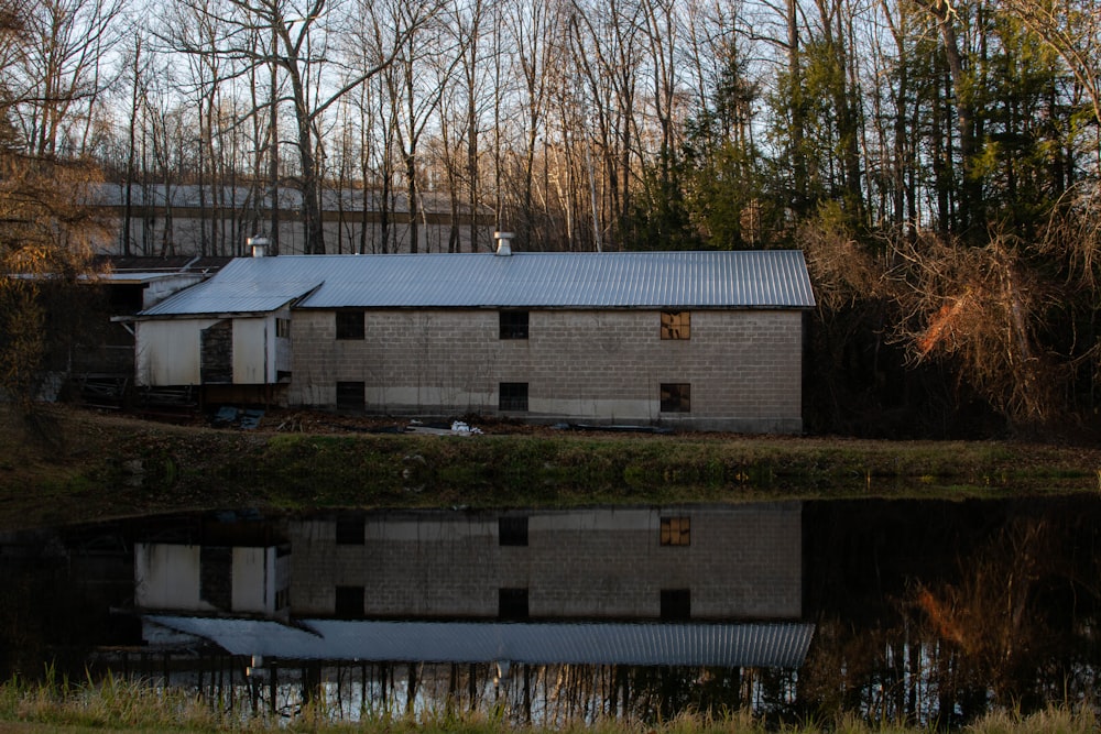 white and brown concrete building near body of water during daytime