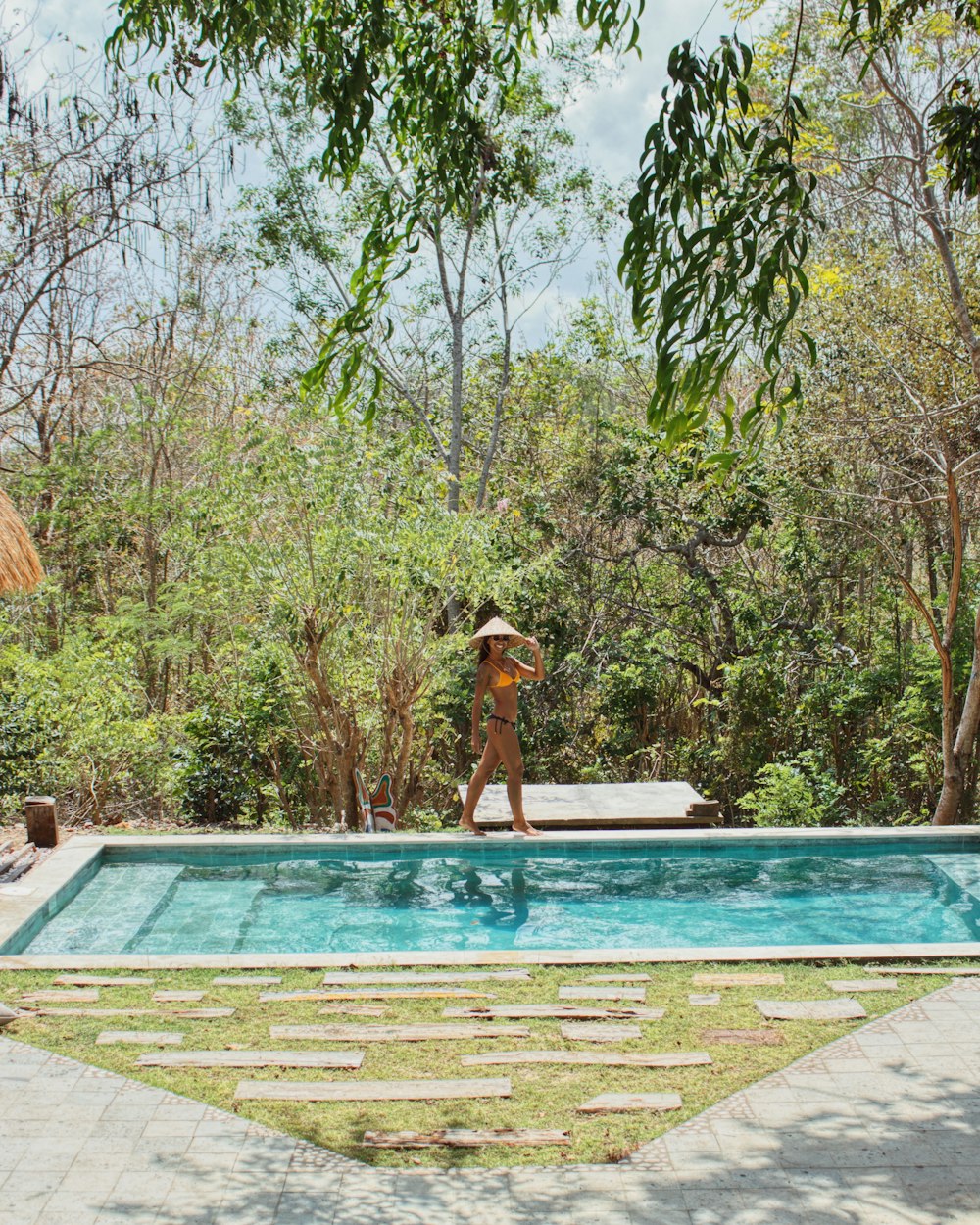 woman in swimming pool during daytime