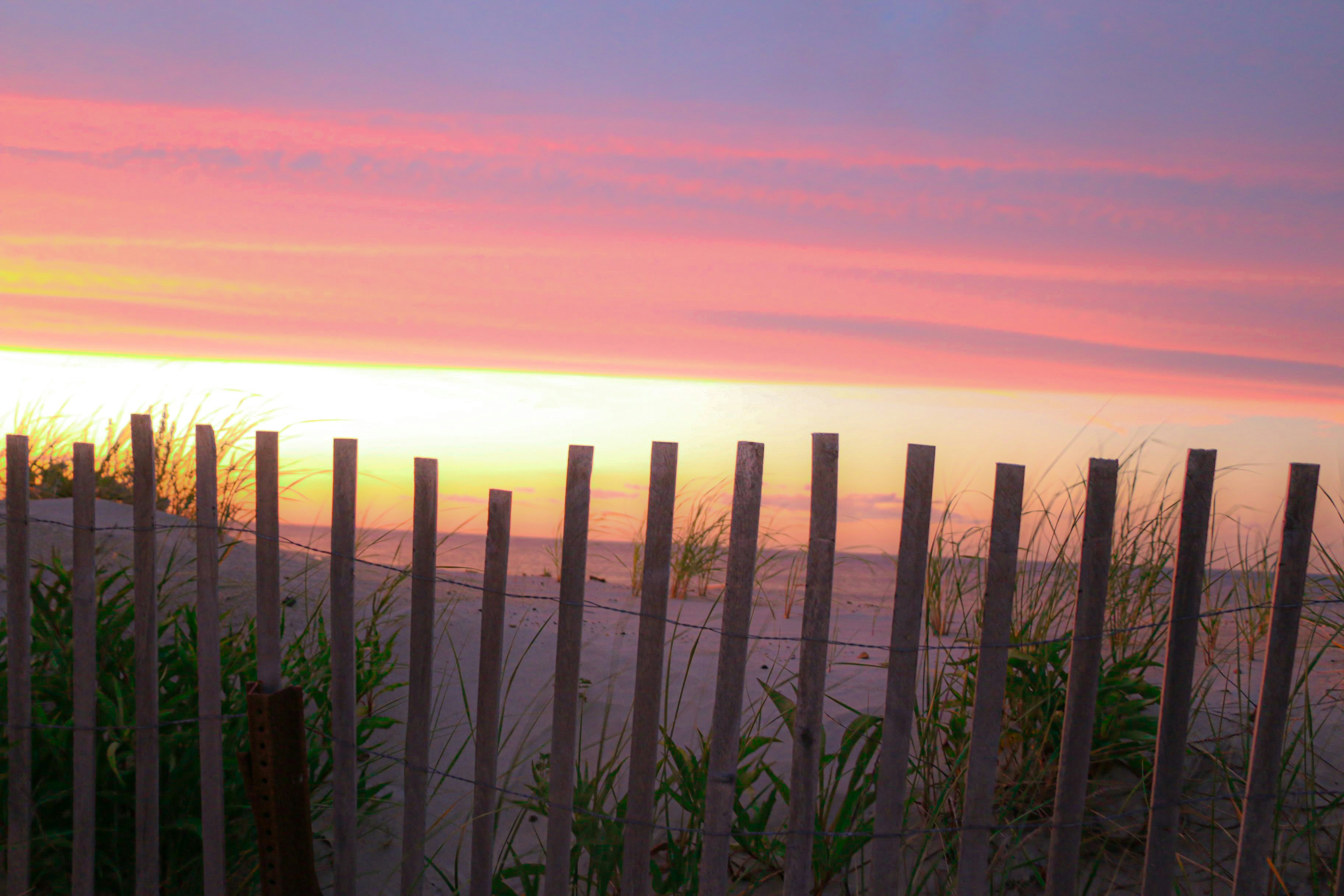 brown wooden fence during sunset cape cod zoom background
