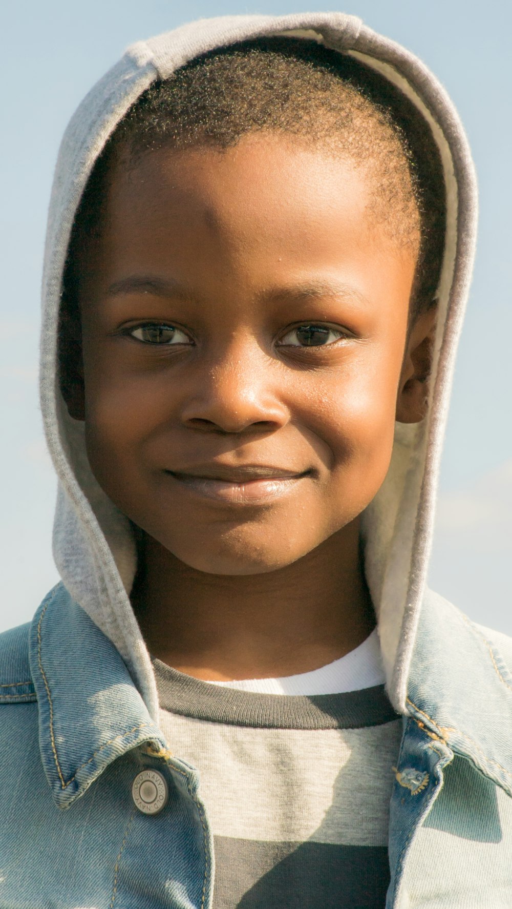 boy in blue and white hoodie