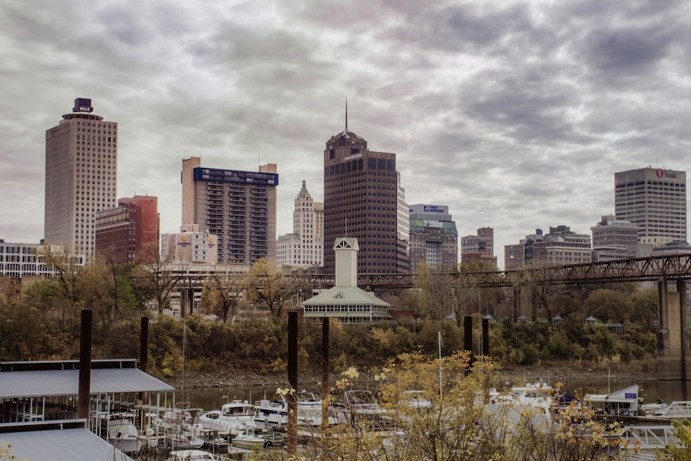 city skyline under cloudy sky during daytime