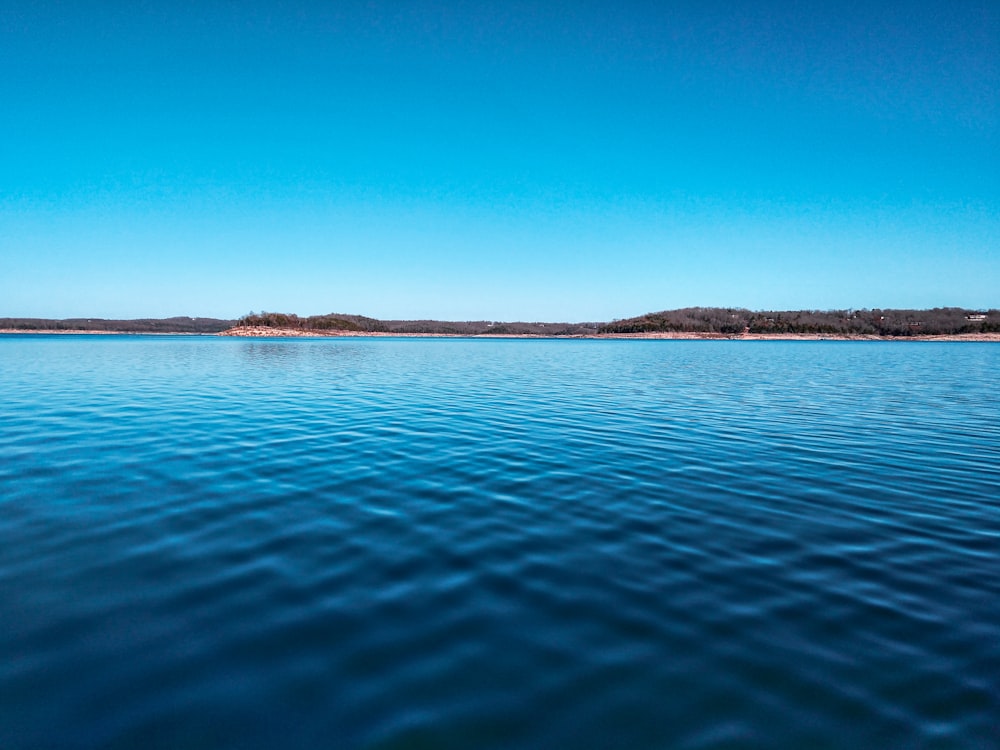 blue sea under blue sky during daytime