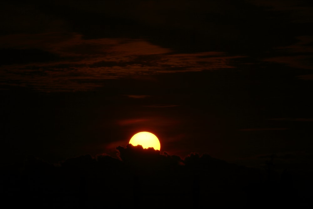 sun setting over the clouds