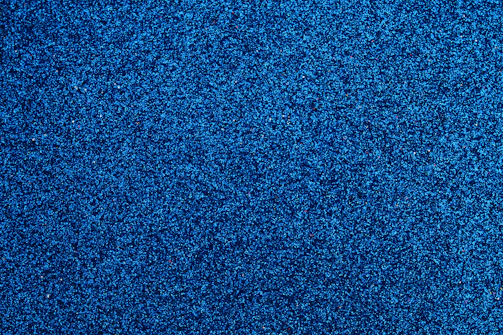 Blue-tinted nano powder particles clustered together with a soft glow.