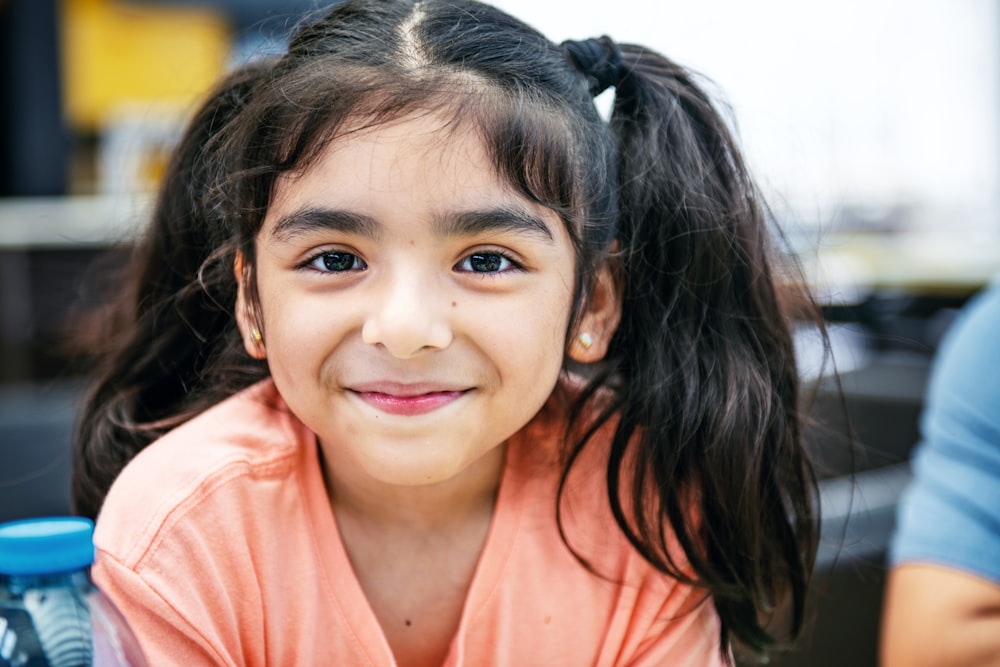 girl in pink v neck shirt