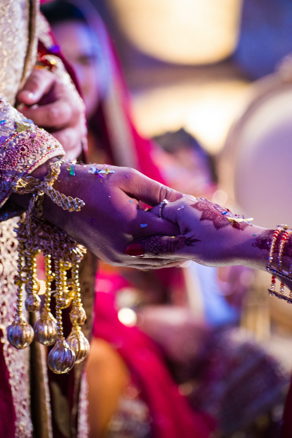 person wearing gold and silver ring