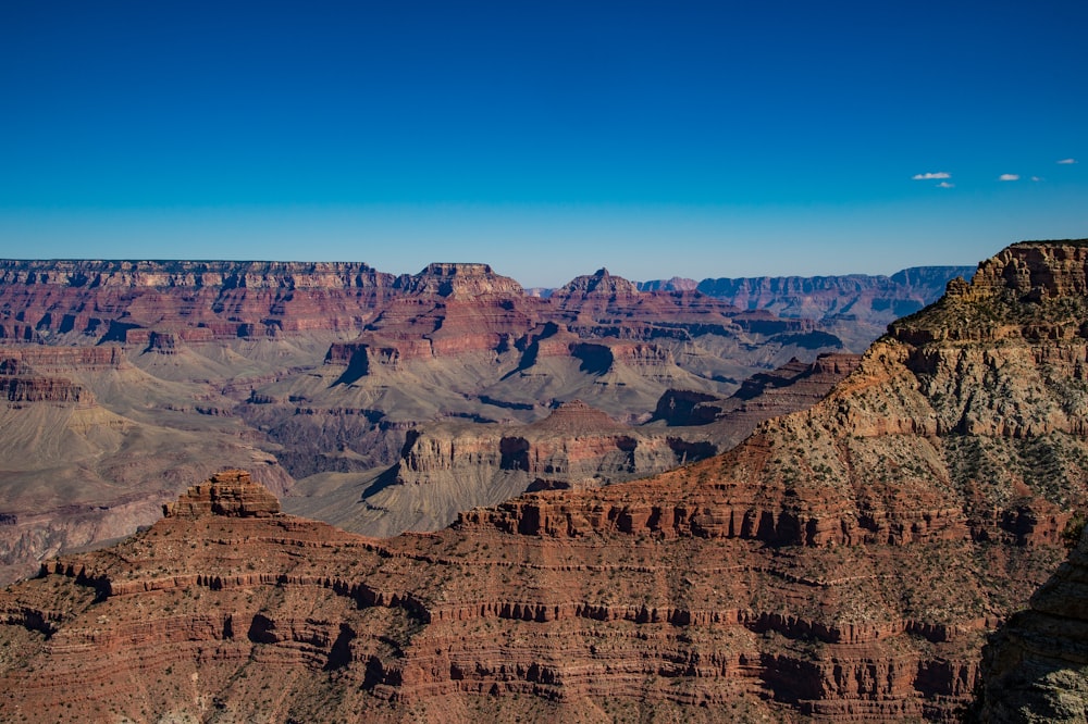 brown rocky mountain under blue sky during daytime